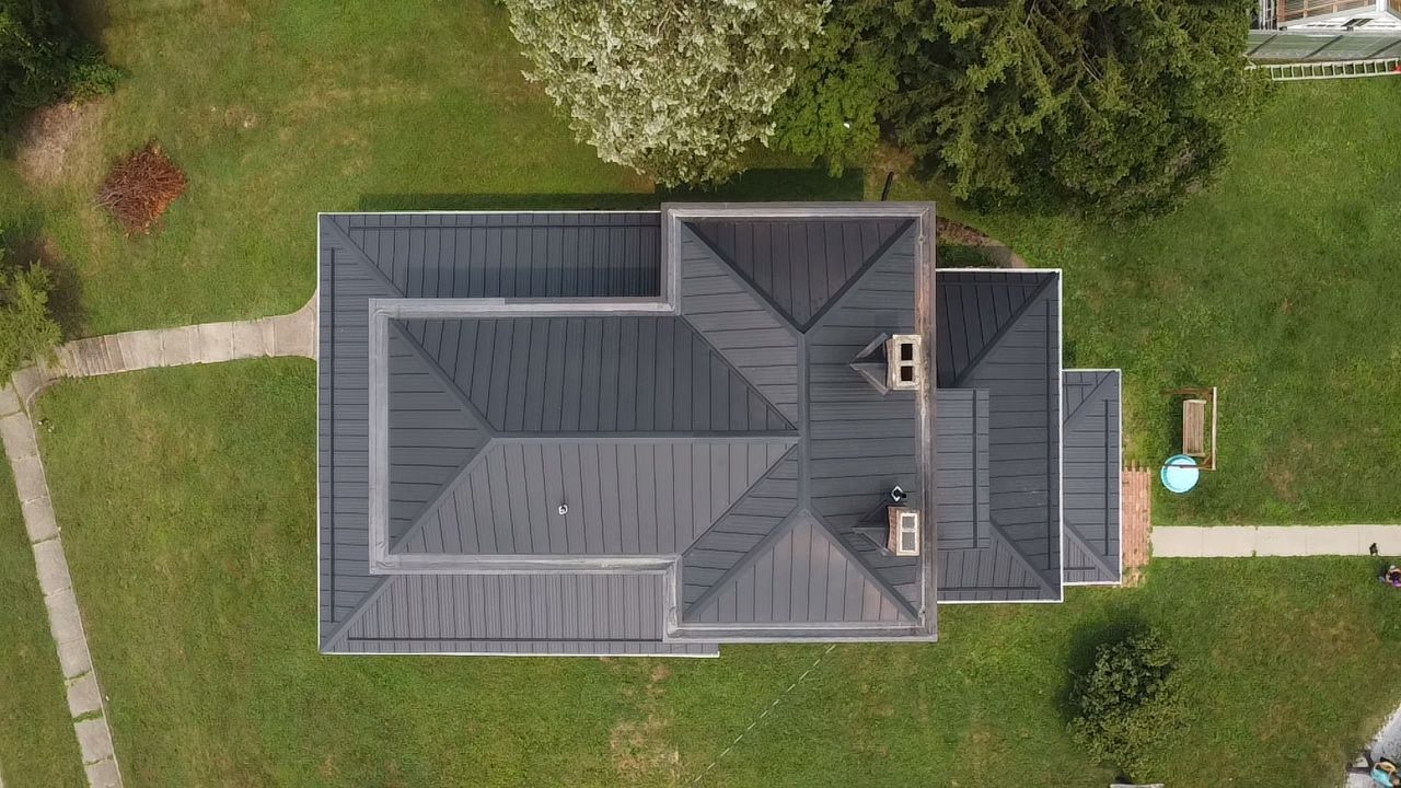Aerial view of a charcoal metal roof on a home