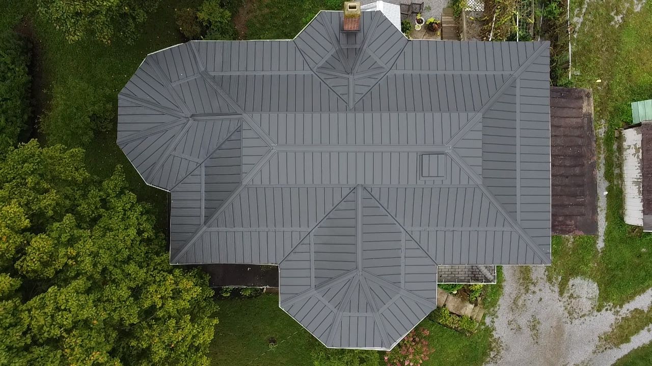 Hip-style gray metal roof, aerial view