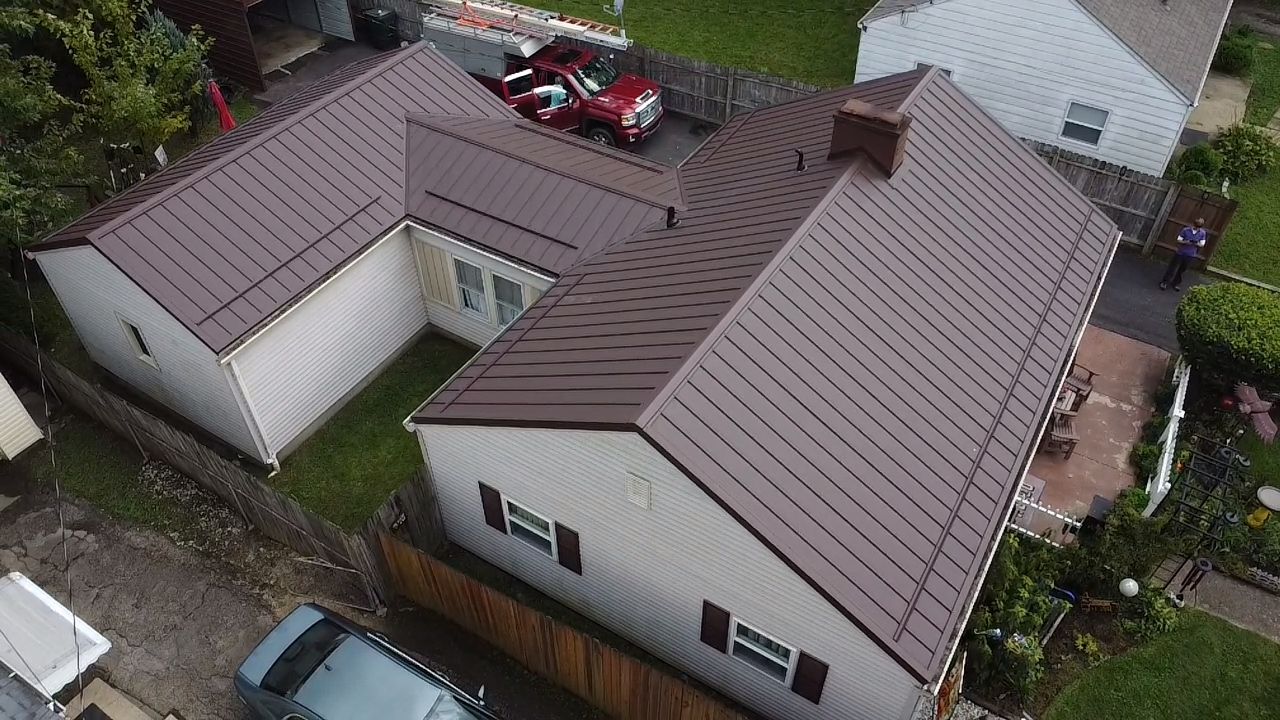 Burgundy metal roof on a ranch home